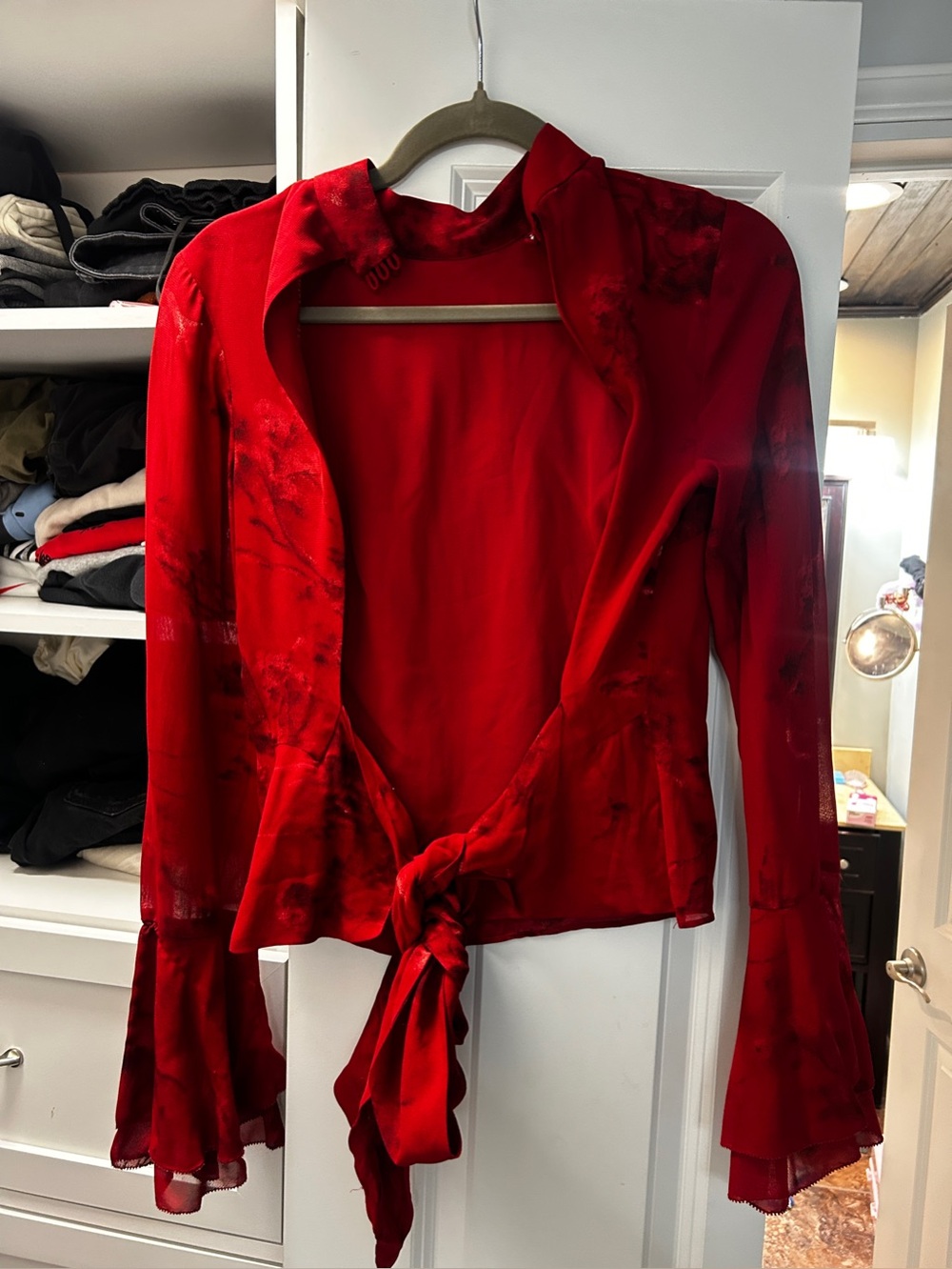 Roxana top in a vermillion red floral print, featuring a mock neck & flutter sle - Picture 9 of 13